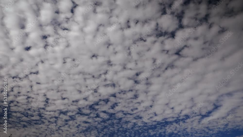 Picturesque timelapse of white fluffy clouds moving softly on clear blue sky Picturesque timelapse of white fluffy clouds moving softly on clear blue sky