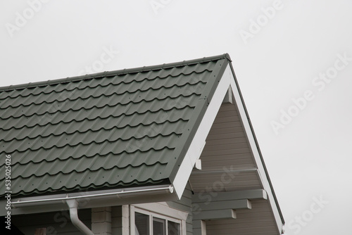 Metal tile.Roof for the house. Modern coatings for the roof of the house. photo