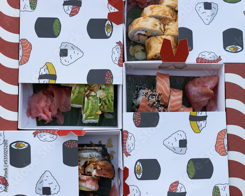 sushi pieces with chopsticks photo