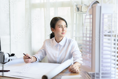 Asian woman smart architect look out the window to rest one's eyes or relax while working in light and bright office room, Concentrate on work and idea management, Working on architect-designer jobs. Free Download Asian woman smart architect look out the window to rest one's eyes or relax while working in light and bright office room, Concentrate on work and idea management, Working on architect-designer jobs. - GFXLoad