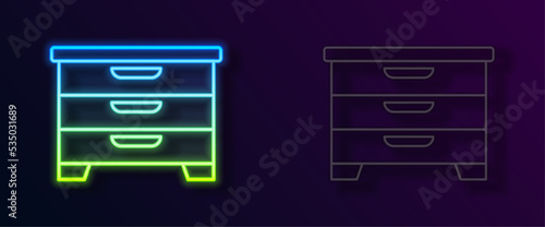 Glowing neon line Chest of drawers icon isolated on black background. Vector