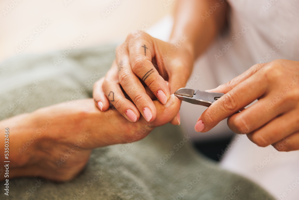Woman Enjoying Pedicure Treatment At A Beauty Salon
