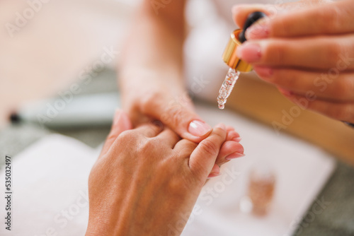 Woman Enjoying Manicure Spa Treatment At A Beauty Salon
