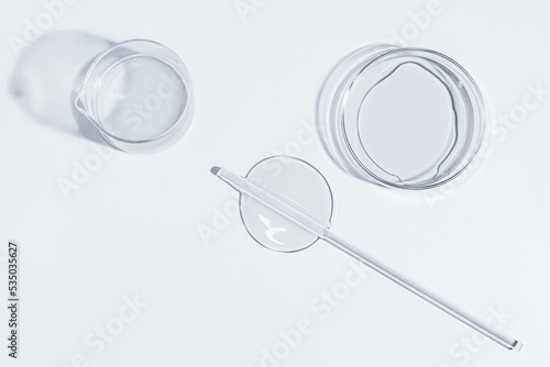 Petri dish, gel, flask, crystallization bowl. Laboratory. View from above. Medicine, gel texture, white, pipette, samples, research. Material collection. Glass baguette.