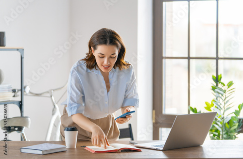 woman working in the office © Konstantin Yuganov