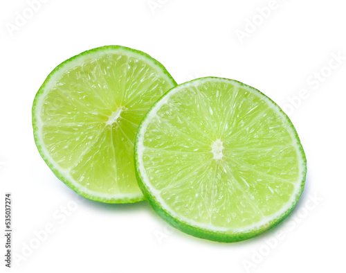 Close up photo of two slices of green lemon isolated on white background with clipping path