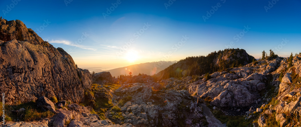 Rocky top of Canadian Mountain Landscape. Sunny Sunset Sky. Top of Mt Seymour near Vancouver, British Columbia, Canada. Nature Background Panorama