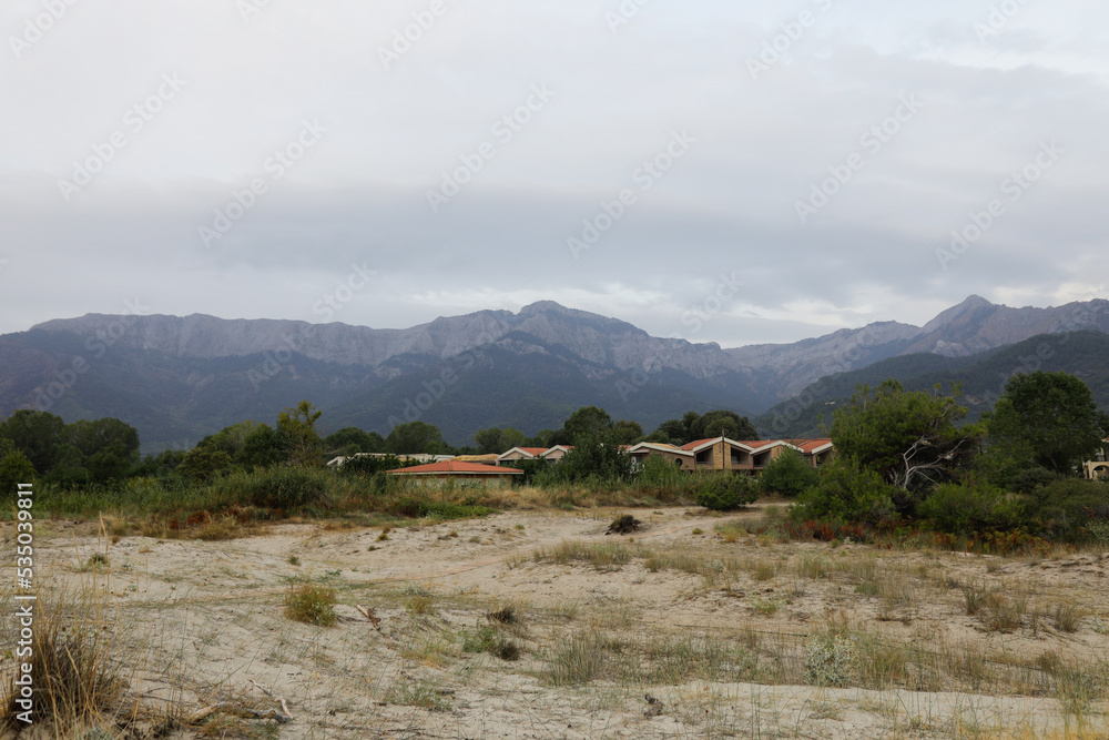 Golden Beach (Skala Potamia) on the Greek island of Thassos during a cloudy summer morning. Golden Beach (Skala Potamia) on the Greek island of Thassos during a cloudy summer morning.