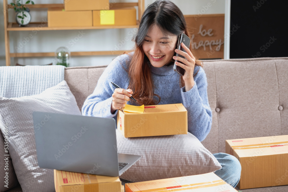 Young Asian SME businessman starting a small and boxed SME business as an online business. Online SME business concept. Young Asian SME businessman starting a small and boxed SME business as an online business. Online SME business concept.