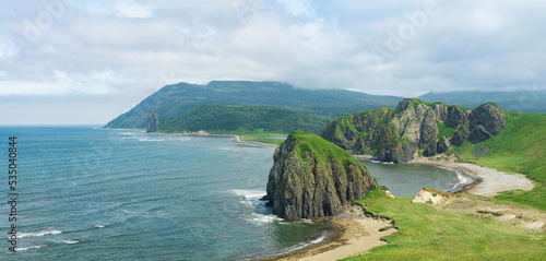 aerial view of the beautiful coastline of Kunashir island with basalt cliffs photo