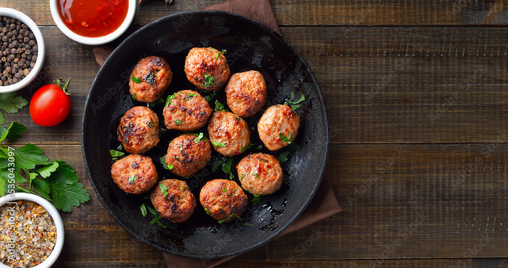 Roasted meatballs in frying pan Roasted meatballs in frying pan
