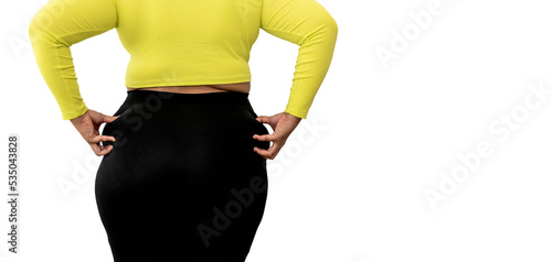 The back of a fat woman using hands to pinch on the hips Which is large and full of excess fat on white isolated background, to fat woman and health care concept. photo