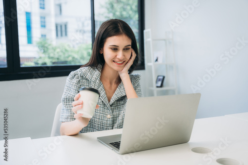 Businesswoman looking camera and a meeting about papers and concepts in office with a cup of coffee