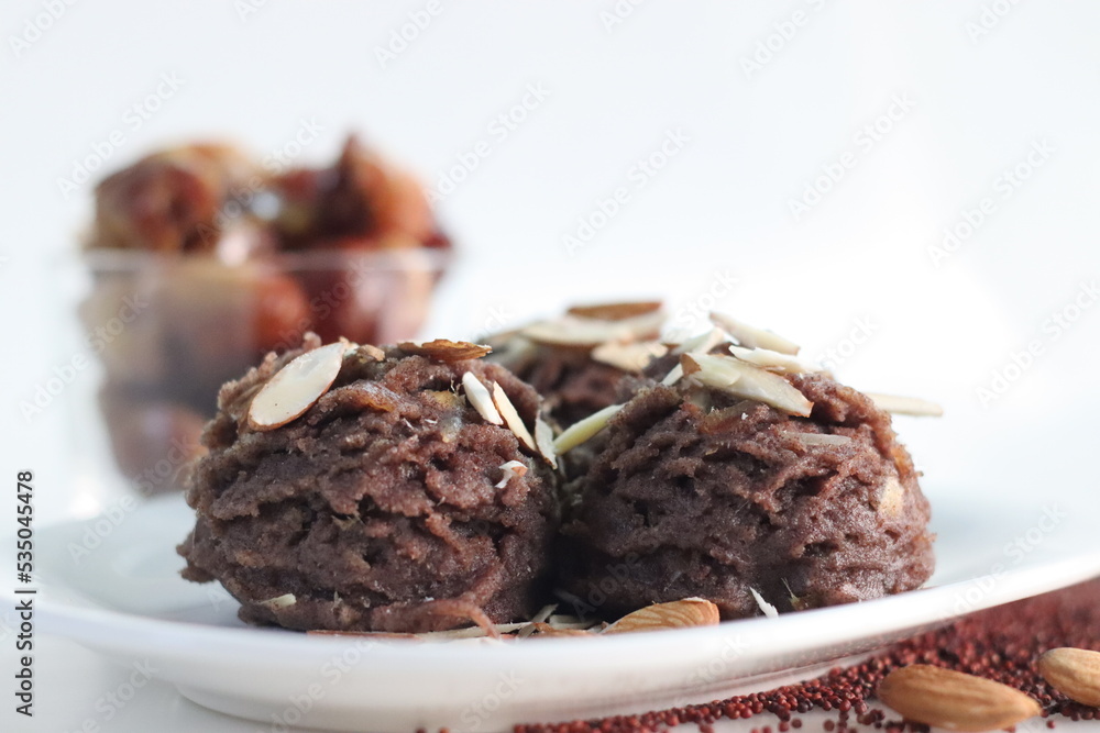 Ragi dates Sheera. Indian pudding made of finger millet flour ghee, milk, dates and dry fruits. Traditionally known as ragi halwa Ragi dates Sheera. Indian pudding made of finger millet flour ghee, milk, dates and dry fruits. Traditionally known as ragi halwa