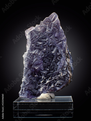 A wonderful item from the mineralogical collection. Fluorite mineral crystal on a black background.