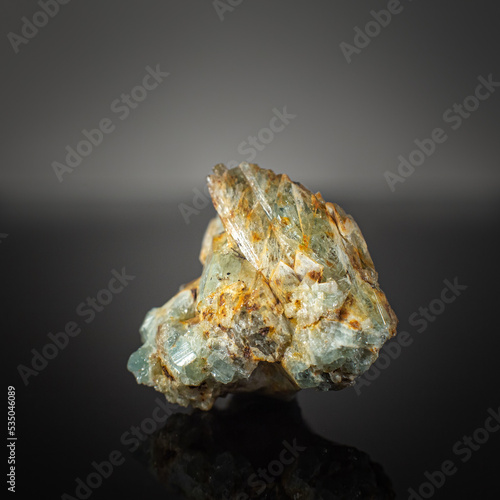 A wonderful item from the mineralogical collection. Beryl mineral crystal on a dark background.