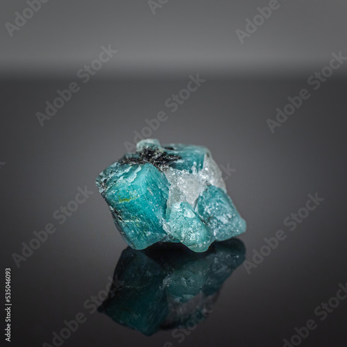 A wonderful item from the mineralogical collection. Beryl mineral crystal on a dark background.