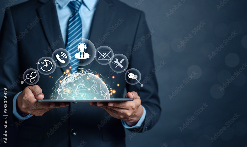 Businessman using a tablet and touching on virtual screen world contact icons. Contact us or Customer support hotline people connect. ( email, address, live chat, internet wifi ) Businessman using a tablet and touching on virtual screen world contact icons. Contact us or Customer support hotline people connect. ( email, address, live chat, internet wifi )