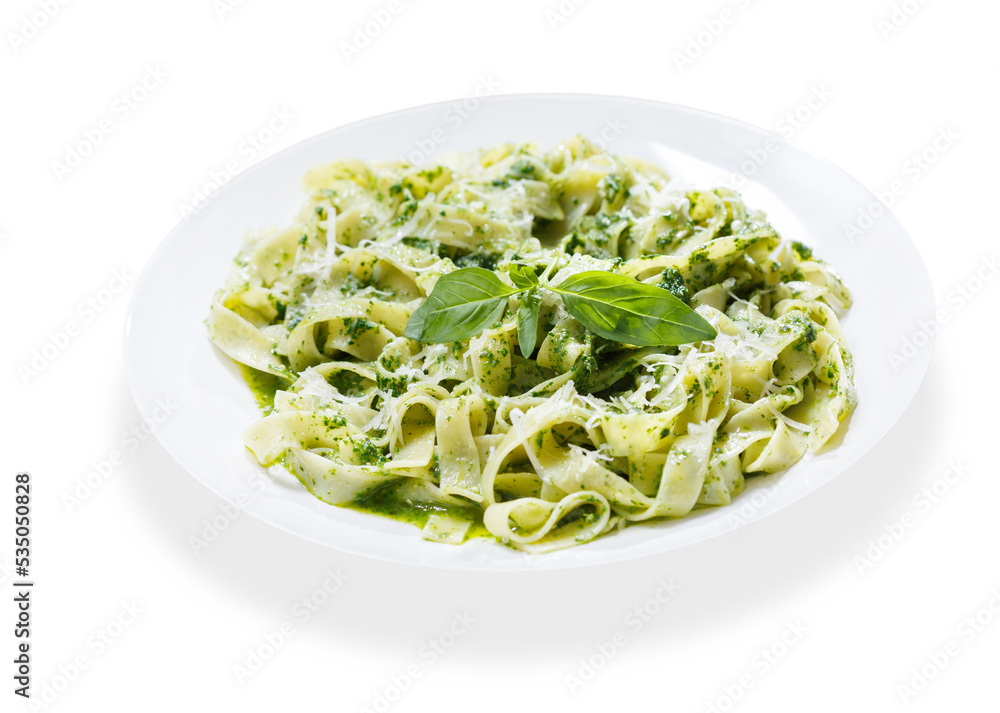 plate of pasta with pesto sauce on white background
