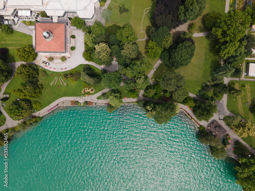 Ciani Park in the South switzerland n the summer of Ticino during the pandemic and the green lake next to the green trees and the houses