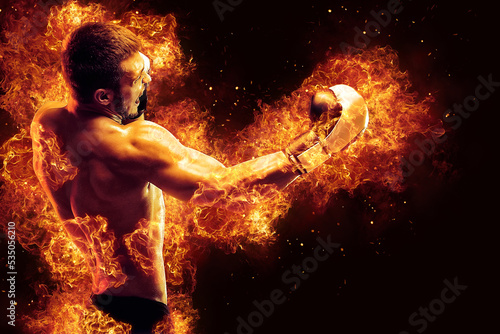 Fighter man punching in fire