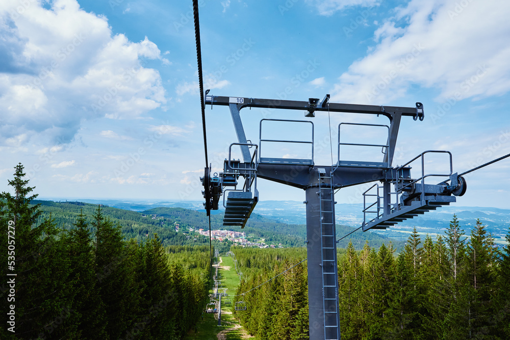 Open cable car line. Metal cable and moving rollers on platform for funicular mechanism, close up. Karpacz resort in Poland with lift road Open cable car line. Metal cable and moving rollers on platform for funicular mechanism, close up. Karpacz resort in Poland with lift road