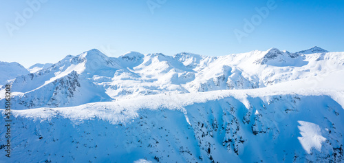 Peaks mountain Pirin covered in snow in Winter sunny day. Bansko  Bulgaria