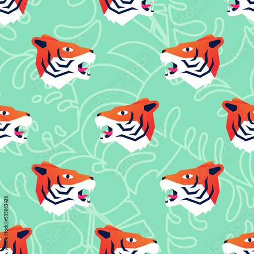 Funny crazy cartoon tiger heads on tropical green leaves background seamless pattern vector illustration