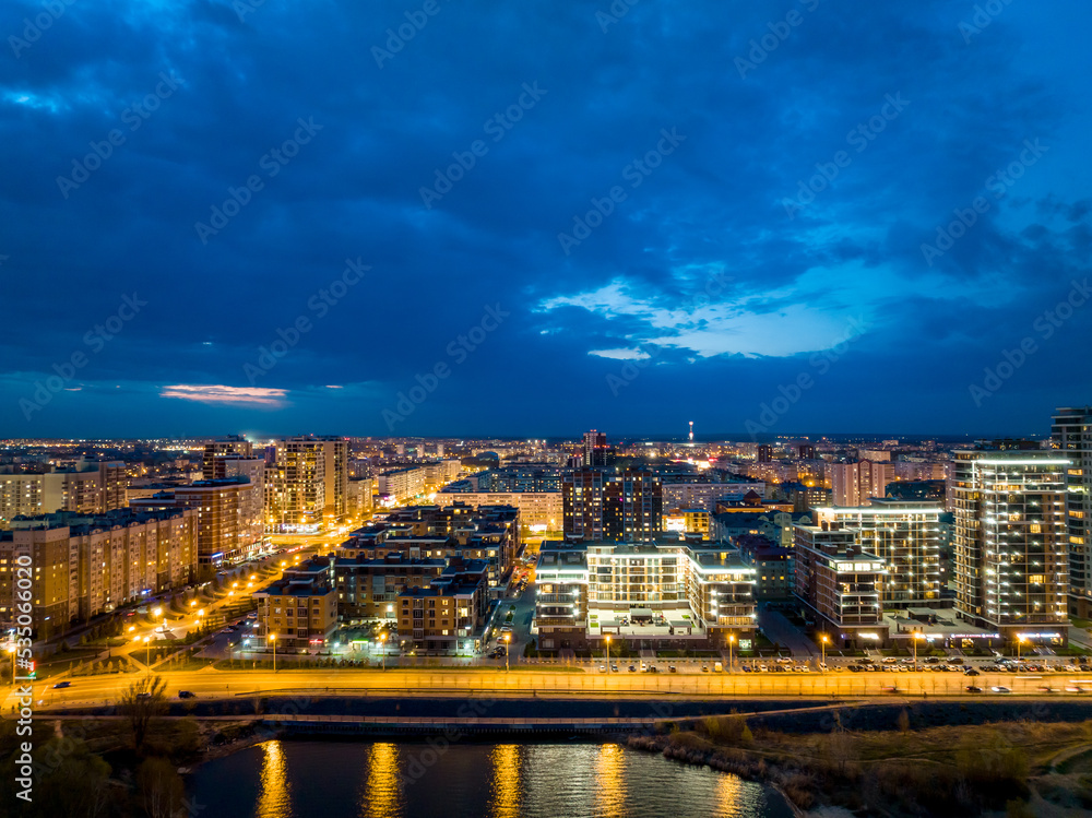 Panorama night city Kazan. View of the new quarters of new buildings in the evening illumination