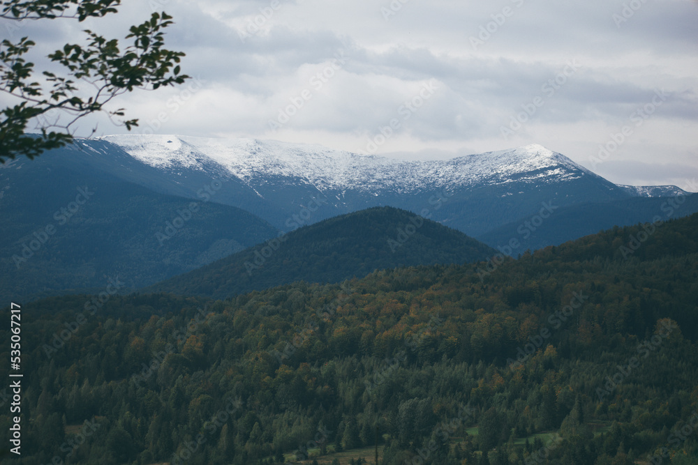 mountain tops covered with snow, autumn