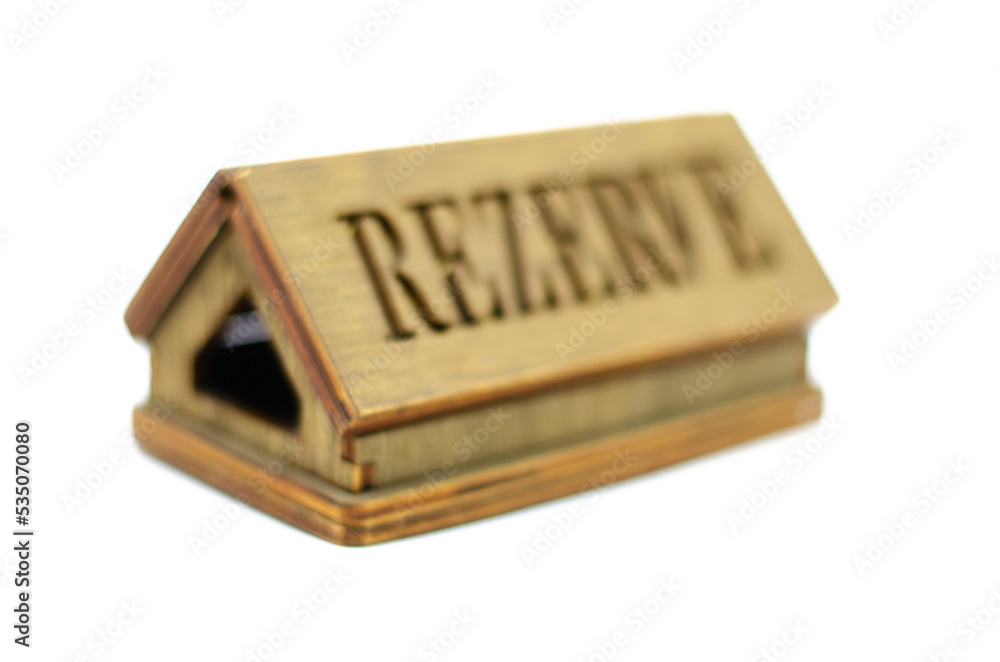 Table reservation letter. On isolated background
desktop wooden reservation sign. selective focus Table reservation letter. On isolated background
desktop wooden reservation sign. selective focus