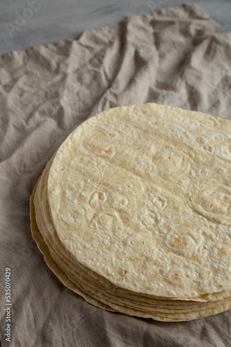Homemade Wheat Flour Tortillas in a Stack, side view. Copy space.