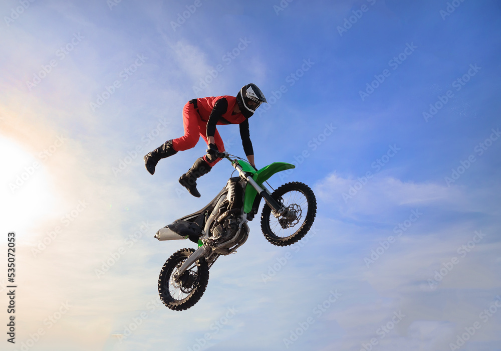 Moto freestyle jump rider on a motorcycle Moto freestyle jump rider on a motorcycle