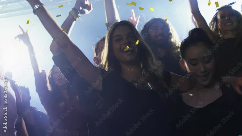 Animation of confetti over diverse friends dancing Animation of confetti over diverse friends dancing