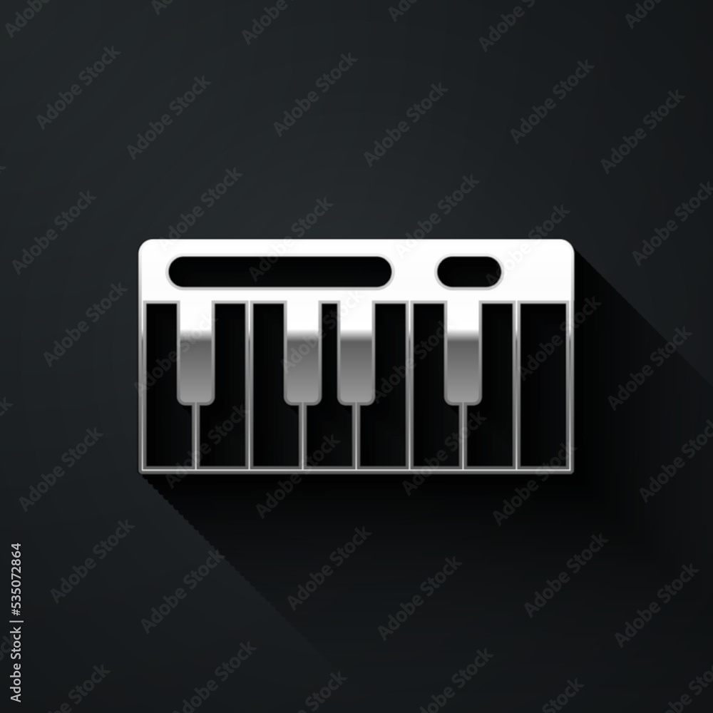 Silver Music synthesizer icon isolated on black background. Electronic piano. Long shadow style. Vector