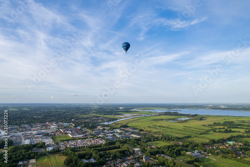 hot air balloon in flight, Netherlands landscape