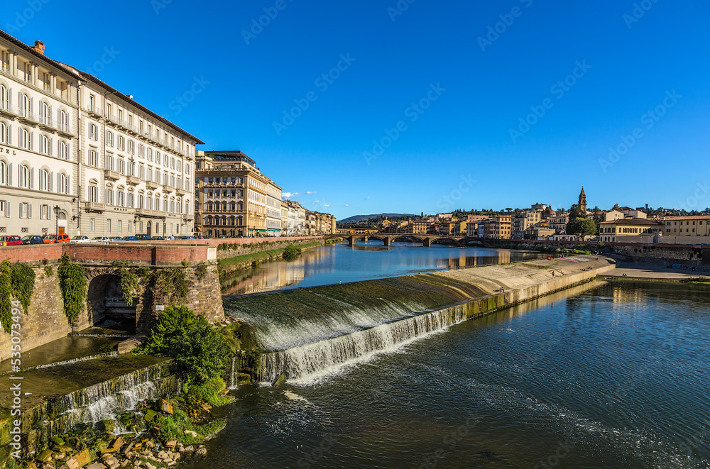 Florence, Italy. Picturesque landscape with a dam on the river Arno