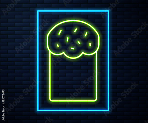 Glowing neon line Easter cake icon isolated on brick wall background. Happy Easter. Vector