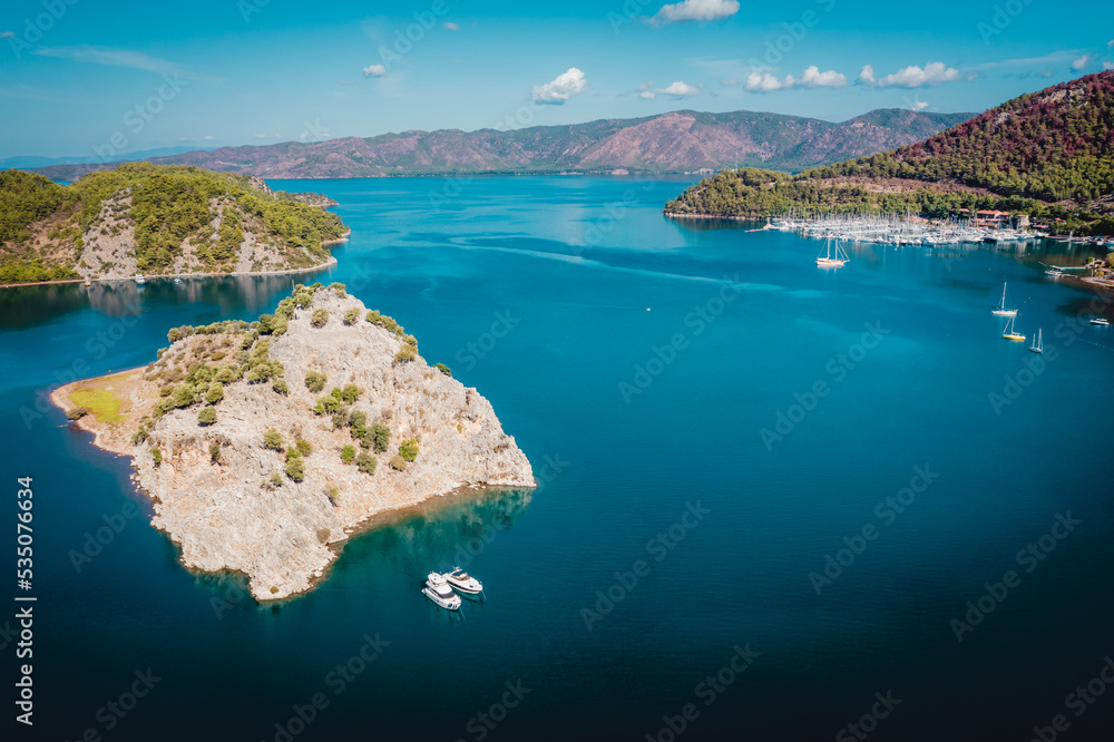 Aerial view of Orhaniye village and Kizkumu beach, on Bozburun peninsula near Marmaris resort town in Turkey.