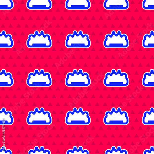 Blue Brass knuckles icon isolated seamless pattern on red background. Vector