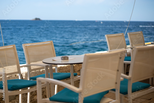 empty seaside cafe table during summer