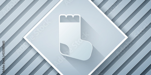 Paper cut Baby socks clothes icon isolated on grey background. Paper art style. Vector