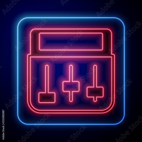 Glowing neon Drum machine music producer equipment icon isolated on black background. Vector