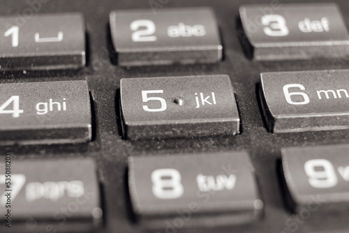 Buttons with numbers for dialing on a landline phone in the office, close-up © Андрей Журавлев