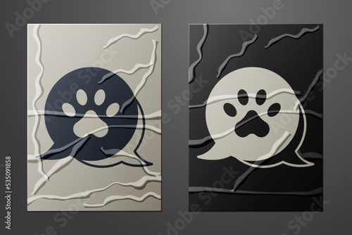 White Paw print icon isolated on crumpled paper background. Dog or cat paw print. Animal track. Paper art style. Vector
