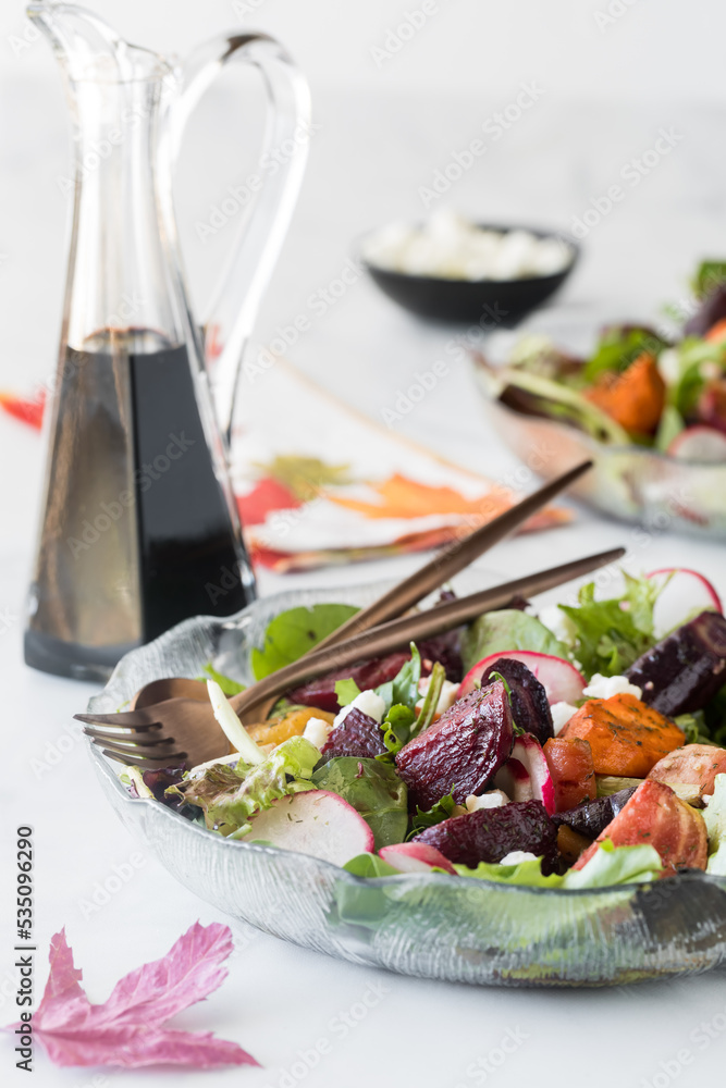 Roasted beet and carrot salad topped with feta and balsamic dressing. Roasted beet and carrot salad topped with feta and balsamic dressing.