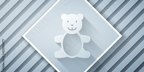 Paper cut Teddy bear plush toy icon isolated on grey background. Paper art style. Vector