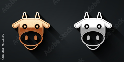 Gold and silver Cow head icon isolated on black background. Long shadow style. Vector