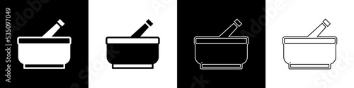 Set Mortar and pestle icon isolated on black and white background. Vector
