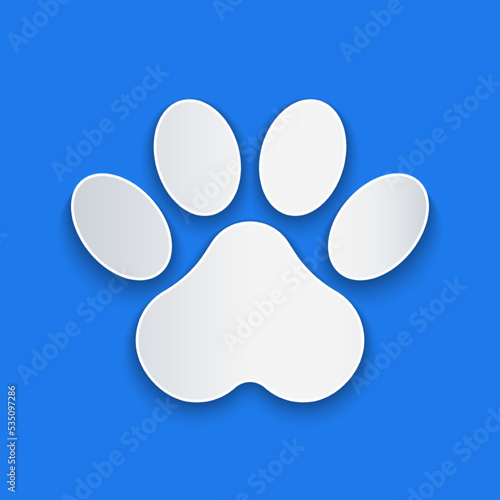 Paper cut Paw print icon isolated on blue background. Dog or cat paw print. Animal track. Paper art style. Vector